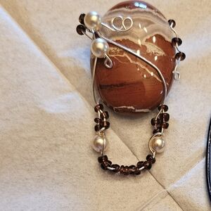 Elegant Brown Stone Eye Glass Pin with Pearl Accents